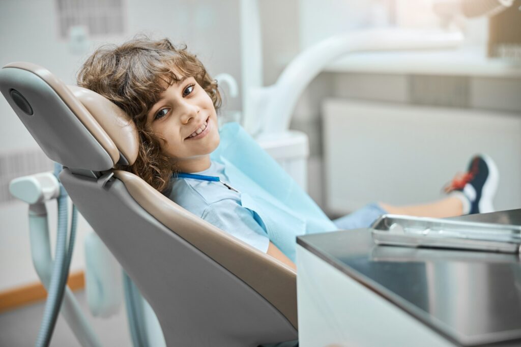 Curly child waiting for a dental examination